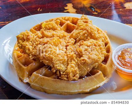 Close up shot of deep fried chicken with waffle 85494830