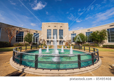 Sunny exterior view of a fountain and Louisiana State Exhibit Museum 85495408