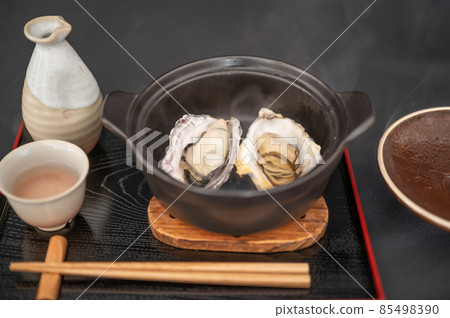 Delicious steamed oysters and hot sake in winter Delicious steamed oysters and hot sake in winter 85498390