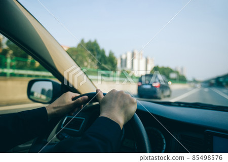 Driving car in modern city Driving car in modern city 85498576