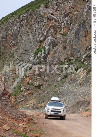 Driving off road car in high altitude mountains 85498697