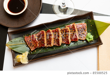 Popular Japanese dish Tataki from tuna with an appetizing ponzu sauce Popular Japanese dish Tataki from tuna with an appetizing ponzu sauce 85500525