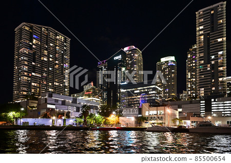 Brickell City Centre and surrounding buildings on Miami River at night. 85500654