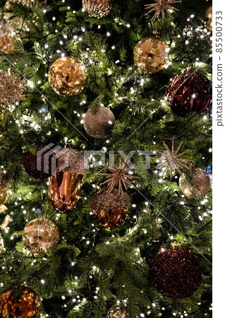 Golden, silver, purple, red, shiny ornate green Christmas tree and decorations Golden, silver, purple, red, shiny ornate green Christmas tree and decorations 85500733