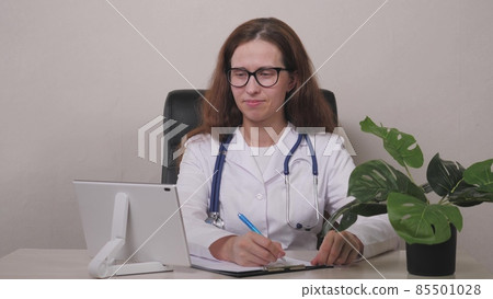 Point of View: Man Using Smartphone to Talk to His Doctor via Video Conference Medical App. Person Checks Symptoms, Talks with Physician, Using Online Video Chat Application. 85501028