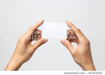 business man hand holding business card isolated on white background with clipping path 85501902