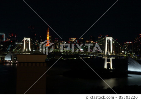 Tokyo's iconic Rainbow Bridge as seen at night from Odaiba with Tokyo Tower in the background Tokyo's iconic Rainbow Bridge as seen at night from Odaiba with Tokyo Tower in the background 85503220