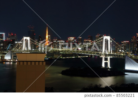 Tokyo's iconic Rainbow Bridge as seen at night from Odaiba with Tokyo Tower in the background Tokyo's iconic Rainbow Bridge as seen at night from Odaiba with Tokyo Tower in the background 85503221
