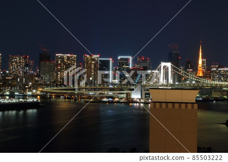 Tokyo's iconic Rainbow Bridge as seen at night from Odaiba with Tokyo Tower in the background Tokyo's iconic Rainbow Bridge as seen at night from Odaiba with Tokyo Tower in the background 85503222