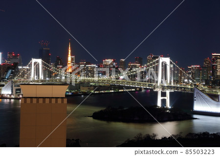 Tokyo's iconic Rainbow Bridge as seen at night from Odaiba with Tokyo Tower in the background Tokyo's iconic Rainbow Bridge as seen at night from Odaiba with Tokyo Tower in the background 85503223