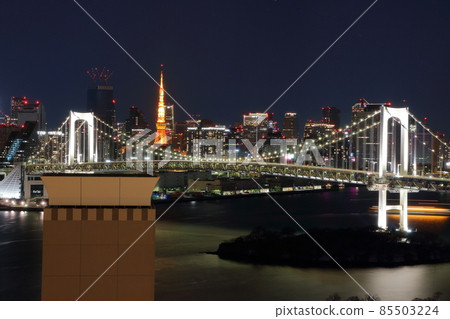 Tokyo's iconic Rainbow Bridge as seen at night from Odaiba with Tokyo Tower in the background Tokyo's iconic Rainbow Bridge as seen at night from Odaiba with Tokyo Tower in the background 85503224
