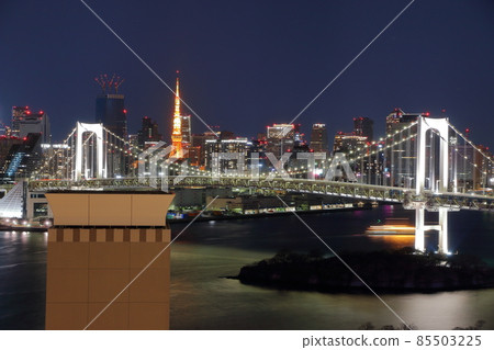 Tokyo's iconic Rainbow Bridge as seen at night from Odaiba with Tokyo Tower in the background Tokyo's iconic Rainbow Bridge as seen at night from Odaiba with Tokyo Tower in the background 85503225