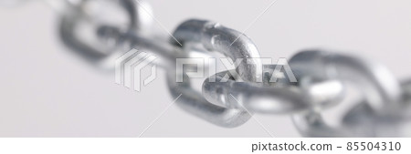 Chromed metal chain links in air closeup 85504310
