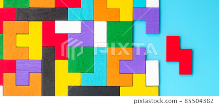 colorful wood puzzle pieces on blue background, geometric shape block. Concepts of logical thinking, Conundrum, solutions, rational, strategy, world logic day and Education colorful wood puzzle pieces on blue background, geometric shape block. Concepts of logical thinking, Conundrum, solutions, rational, strategy, world logic day and Education 85504382