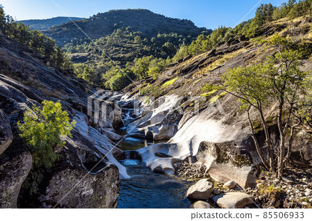 Natural pools of Los Pilones in the Garganta de los infiernos gorge, Jerte valley, Caceres, Spain Natural pools of Los Pilones in the Garganta de los infiernos gorge, Jerte valley, Caceres, Spain 85506933