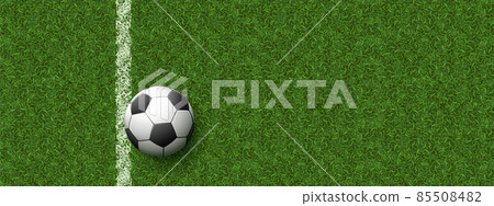 Soccer ball on field with green grass 85508482