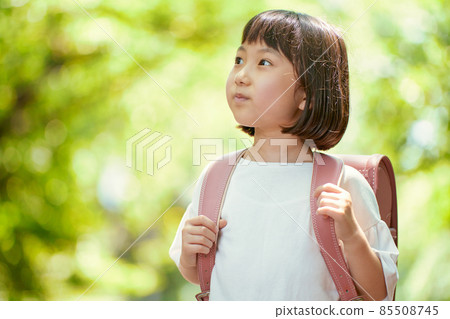 Girls carrying a school bag Girls carrying a school bag 85508745