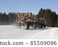 Timber-driven board on winter road 85509096
