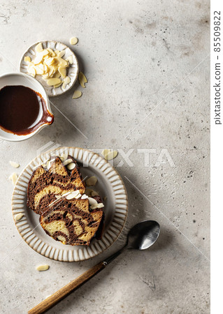 Two slices of zebra cake on a plate, top view, copy space, isolated Two slices of zebra cake on a plate, top view, copy space, isolated 85509822