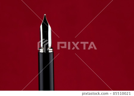 Fountain Pen Point on a Red Background 85510021