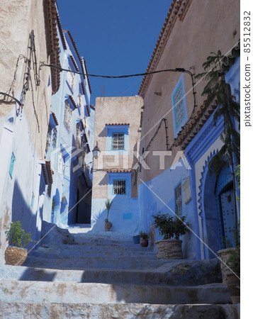 Old stairs at moroccan alley in Chefchaouen city in Morocco - vertical Old stairs at moroccan alley in Chefchaouen city in Morocco - vertical 85512832