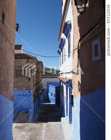 Narrow moroccan street in Chefchaouen city in Morocco - vertical Narrow moroccan street in Chefchaouen city in Morocco - vertical 85512838