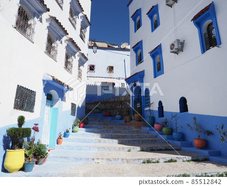 Famous stairs at moroccan alley in african Chefchaouen city in Morocco Famous stairs at moroccan alley in african Chefchaouen city in Morocco 85512842