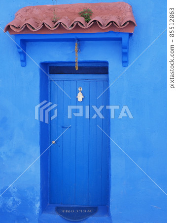 Islamic eave over door in african Chefchaouen town, Morocco - vertical 85512863