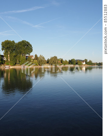 Shore of Rhine River in STEIN AM RHEIN town in SWITZERLAND - vertical 85512883