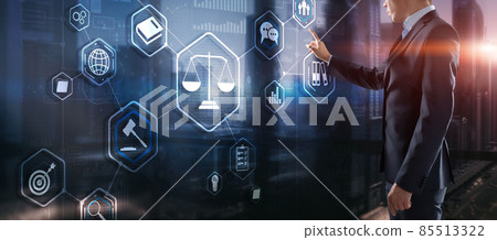 Law. Businessman on abstract blurred background using law protection right 85513322