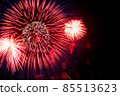 Flash of red and white fireworks on background black sky. Concept of holiday. Close-up 85513623