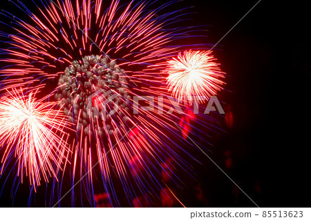Flash of red and white fireworks on background black sky. Concept of holiday. Close-up Flash of red and white fireworks on background black sky. Concept of holiday. Close-up 85513623