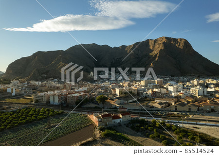Aerial view Callosa de Segura townscape located in foothills. Spain 85514524