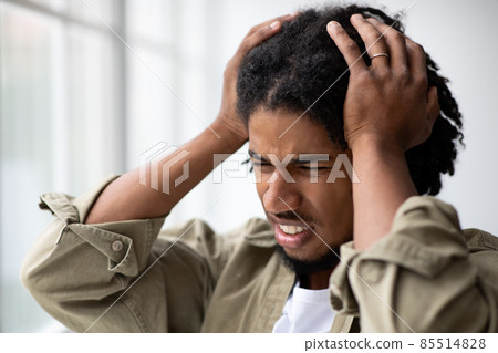Mental Disorders. Portrait Of Stressed Anxious Young African American Man Touching Head 85514828
