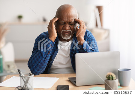 Senior Black Businessman Having Headache Touching Temples Sitting In Office 85515627