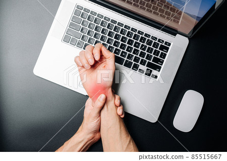 Arthritis hand. Arthritis office syndrome is consequence of computer. Hand pain in man injury wrist. Health care and medical concept. 85515667