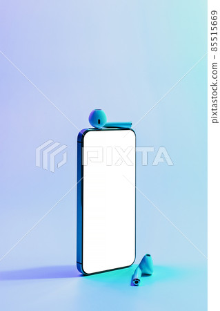 Device mockups. Mobile smartphone technology blank screen. Mock up smart phone device, audio headphones equipment on neon gradient banner background. Mockup for application or website design project. Device mockups. Mobile smartphone technology blank screen. Mock up smart phone device, audio headphones equipment on neon gradient banner background. Mockup for application or website design project. 85515669