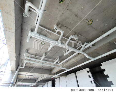 PENANG, MALAYSIA -JANUARY 5, 2021: Sewerage pipes from the toilet above are interconnected under the floor soffit. Installed in gradient and gravity flow. Channeled to the main sewer line. PENANG, MALAYSIA -JANUARY 5, 2021: Sewerage pipes from the toilet above are interconnected under the floor soffit. Installed in gradient and gravity flow. Channeled to the main sewer line. 85516493