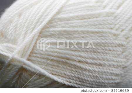 White threads of natural wool close-up in full screen 85516689