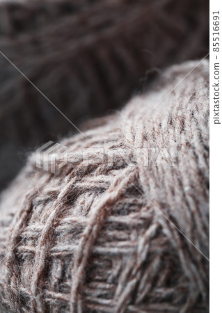 Balls of brown wool yarn made of natural wool. Balls of brown wool yarn made of natural wool. 85516691