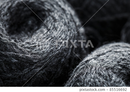 Gray yarn made of natural wool in balls of thread. Gray yarn made of natural wool in balls of thread. 85516692
