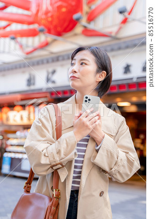 A woman enjoying sightseeing in Osaka A woman enjoying sightseeing in Osaka 85516770
