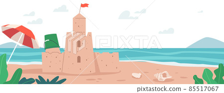 Sand Castle on Sea Beach with Plastic Kids Bucket, Umbrella and Seashells. Summer Travel, Vacation, Sandcastle on Ocean 85517067