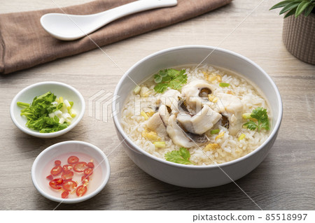 Fish Porridge,rice soup with sliced Tilapia fish.Asian breakfast style Fish Porridge,rice soup with sliced Tilapia fish.Asian breakfast style 85518997
