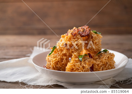 Thai dessert, Mixed Crispy Rice Noodle (Mee Krob) in white plate on wood background Thai dessert, Mixed Crispy Rice Noodle (Mee Krob) in white plate on wood background 85519064