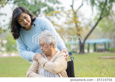Help and care Asian senior or elderly old lady woman use walker with strong health while walking at park in happy fresh holiday. 85519708