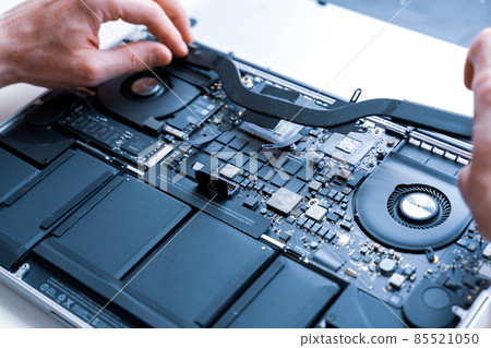 Pc repair service. Computer technician service with laptop on hardware technology background. Maintenance engineer support. Engineer fixing broken computer motherboard. 85521050