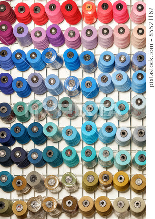 Bobbins of sewing thread in various colors. 85521162