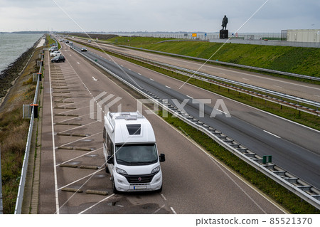 The Afsluitdijk is a major dam and causeway in the Netherlands. It is a fundamental part of the larger Zuiderzee Works, damming off salt water of the North Sea, and turning it into a fresh water lake 85521370