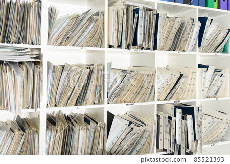 Shelves are full with folders and files of medical record, patient information 85521393